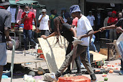 Operation Dudula members destroying hawkers business in Alexandra, Johannesburg. 