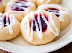 Raspberry Almond Thumbprint Cookies was pinched from <a href="http://sallysbakingaddiction.com/2013/12/12/raspberry-almond-thumbprint-cookies/" target="_blank">sallysbakingaddiction.com.</a>