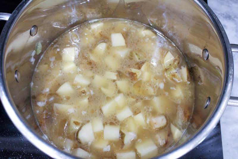 Cooking Onions, Celery, And Potatoes In The Stock Pot.