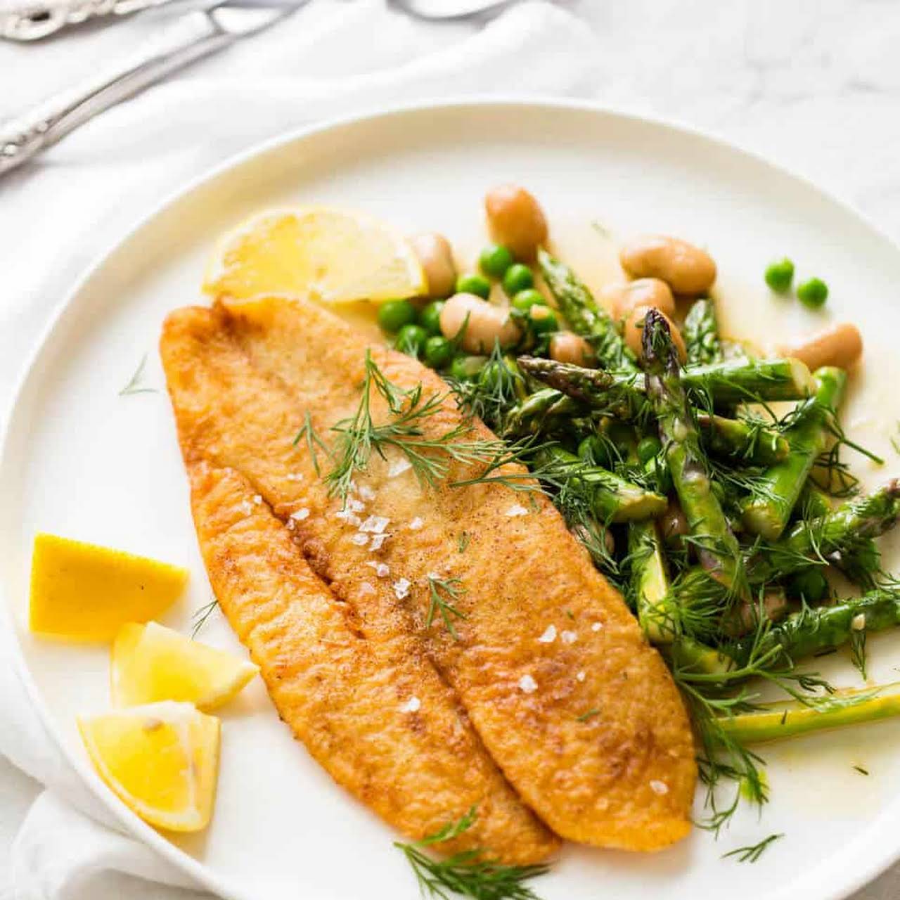 Pan-fried fish fillets with nicoise salad