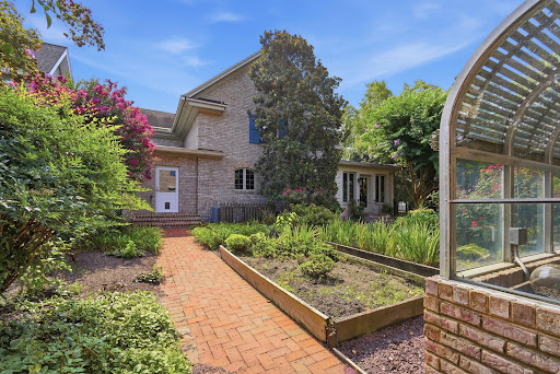 Brick path to house, lush garden in this luxury property for sale in Easton ($1,150,000)