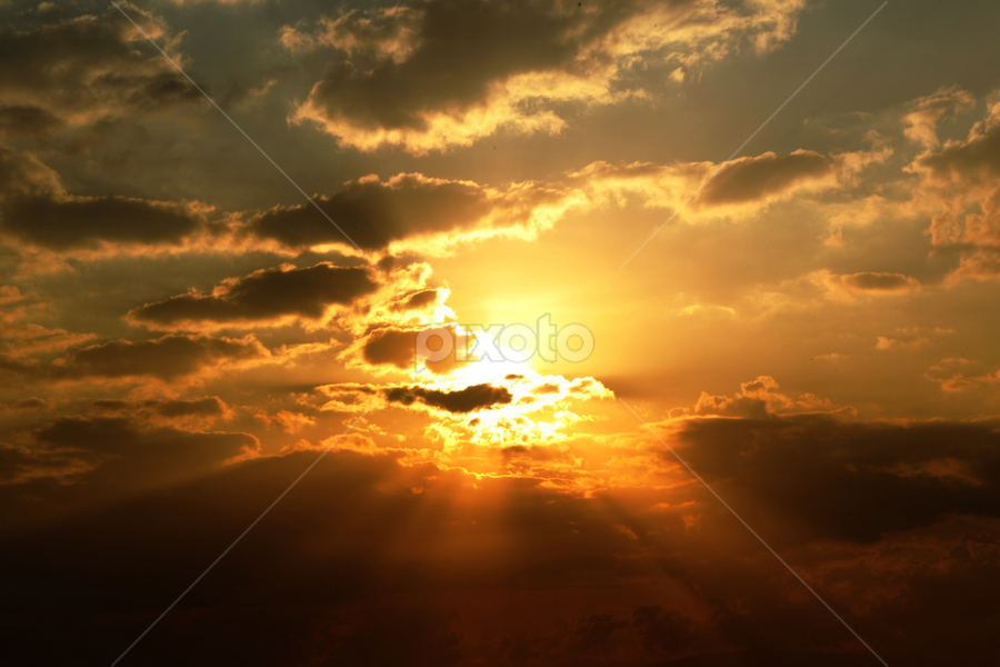 Rising Sun Over Clouds by Buena Vista Images