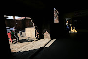 Residents make use of a shop at the Wattville hostel in Benoni, Ekurhuleni on June 28, 2018.