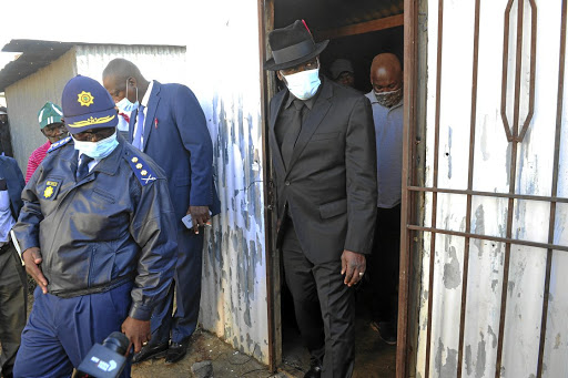 Minister Cele at Jabulani hostel in Soweto, where six people were shot dead. Sipho Mabasa allegedly told police that the mass shooting was planned a few days before the massacre.