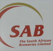 Tony van Kralingen, CEO of SABMiller (SA), displays the new SAB logo.