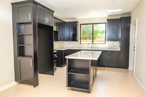 Modern kitchen with black central island - Apartment purchase in Negril, 2 bedrooms