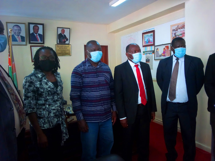 Vihiga Deputy Governor Patrick Saisa (in red tie), Bainito Wamalwa, Ombajo Masini and CEC Pamela Kimwele of the Quakers or Friends Church, in Vihiga, on Saturday, November 21.