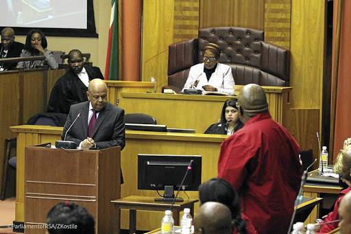 Public enterprises minister Pravin Gordhan delivers his 2019 budget vote in parliament yesterday. / ParliamentofRSA /ZKostile