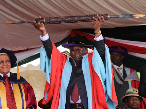 Technical university of Kenya vice chancellor Francis Aduol holds a mace after the institute was announced to be a university on January 15Photo/Monicah Mwangi