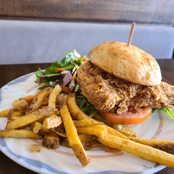 Gluten free fried chicken sandwich with half fries and half salad