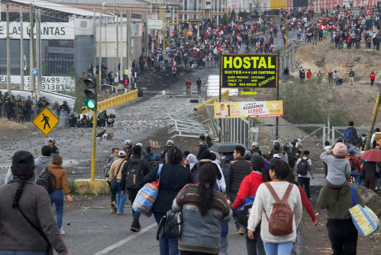 Police block demonstrators from getting closer to the airport during a protest to demand the resignation of Peruvian President Dina Boluarte in Arequipa, Peru, on January 19 2023. Picture: REUTERS/OSWALD CHARCA