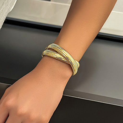 Title 13, Womens Metal Double Ring Spiral Bracelet. A st...