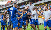 Two-goal hero Judas Moseamedi celebrates with his Maritzburg United teammates after scoring the late winning goal.  