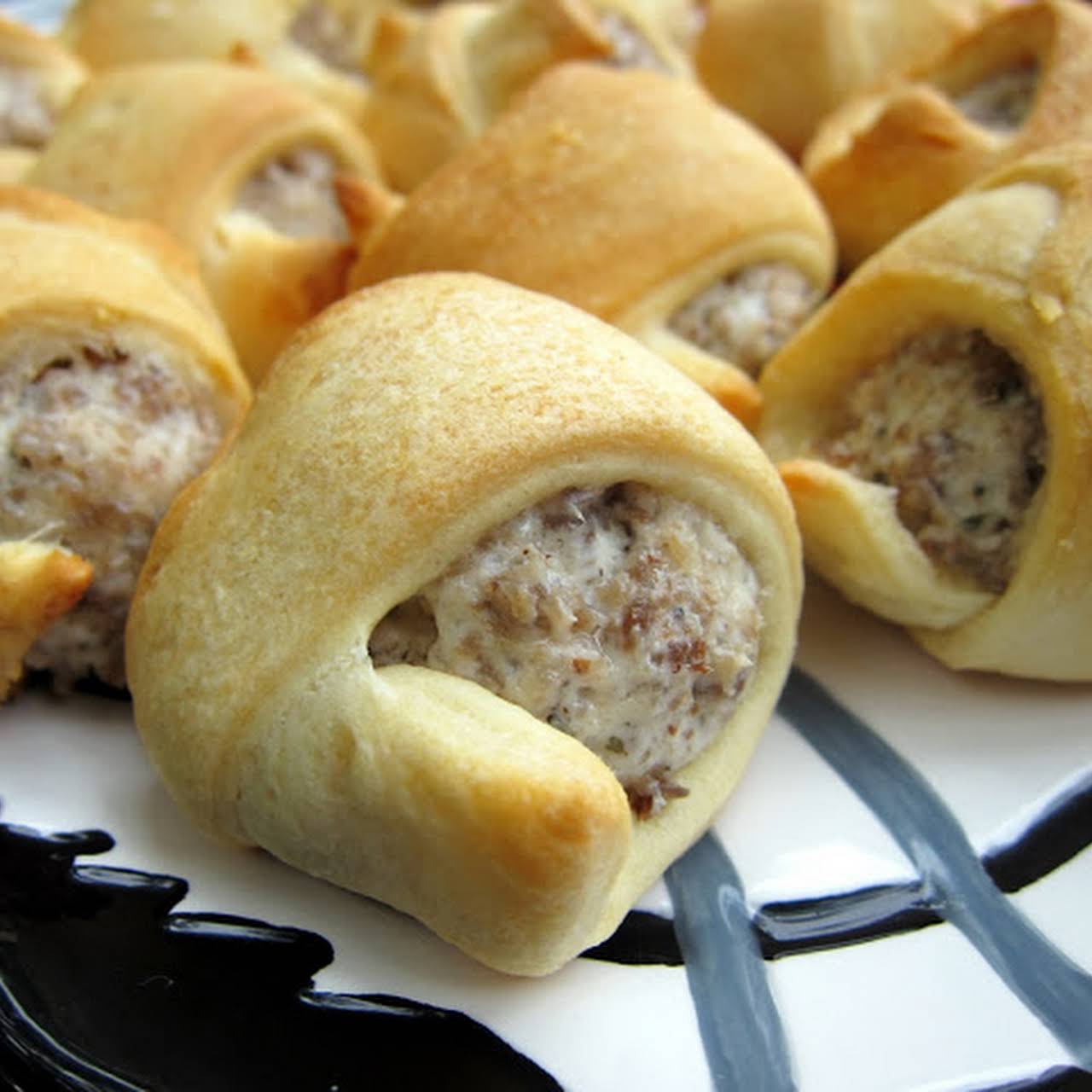 Prepping the cream cheese and sausage filling in Pillsbury Crescent dough  sheets - The Southerly Magnolia