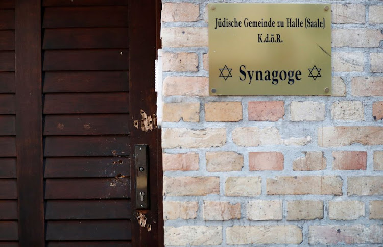 The damaged door of a synagogue is seen in Halle, Germany, on October 10 2019, after two people were killed in a shooting.