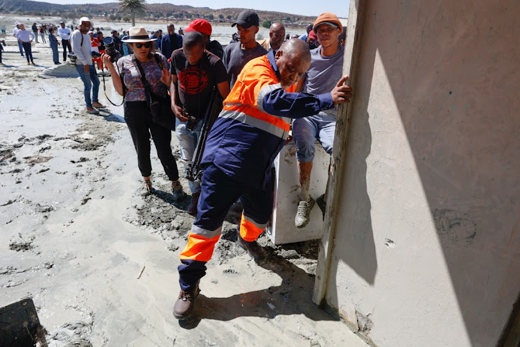 Minister of mineral resource Gwede Mantashe during a walkabout in Charlesville to inspect the damaged caused to his homes after the mudslide from the Jagersfontein Development mine dam damaged houses and infrastructure. On Sunday morning residents work up to raging noise from the damn as the dam wall collapse leaving the small township of Charlesville in ruins.