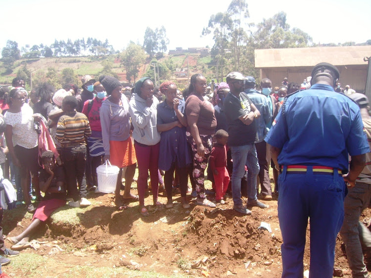 Residents of Limuru town at the scene.