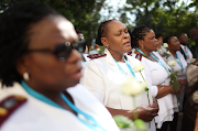 Nurses laid flowers and lit candles in memory of their late colleagues who died during the Covid-19 pandemic. 