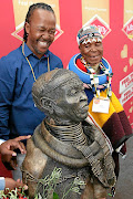 Dr Esther Mahlangu's sculpture is unveiled by artist Albert Nkosi. / ANTONIO MUCHAVE