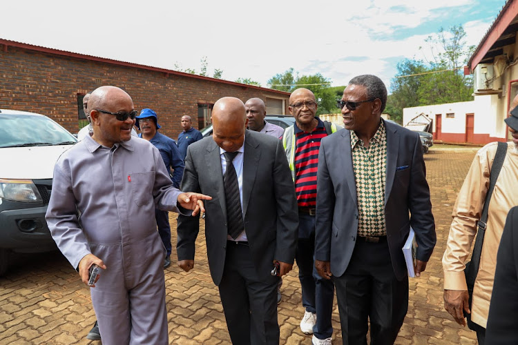 North West premier Bushy Maape, centre, is seen with the department of water and sanitation minister Senzo Mchunu, left, and colleagues. It was Maape's first official duty since his return from five months' sick leave.