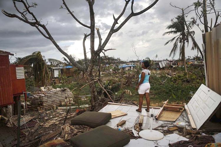 Resident Mirian Medina stands on her property about two weeks after Hurricane Maria swept through the island on October 5, 2017 in San Isidro, Puerto Rico. Puerto Rico experienced widespread damage including most of the electrical, gas and water grid as well as agriculture after Hurricane Maria, a category 4 hurricane, swept through.