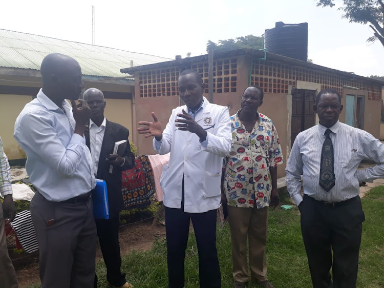 Busia chief Health officer Isaac Omeri (R) at Kocholia Subcounty Hospital. He recently said Busia residents should donate blood following a shortage.