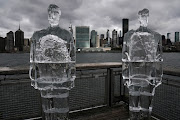 Two ice sculptures depicting US President Donald Trump and Brazil's President Jair Bolsonaro sit across the Hudson River in New York City. 