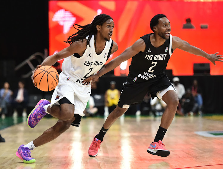 Kedrick Brown of FUS Rabat challenges Billy Preston Jnr of Cape Town Tigers during the 2024 BAL Season 4 match at the SunBet Arena in Pretoria on March 12 2024