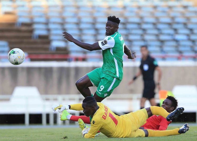 Gor Mahia Yikpe Gnamien leaves Motema Pembe keeper on the ground in yesterday's action