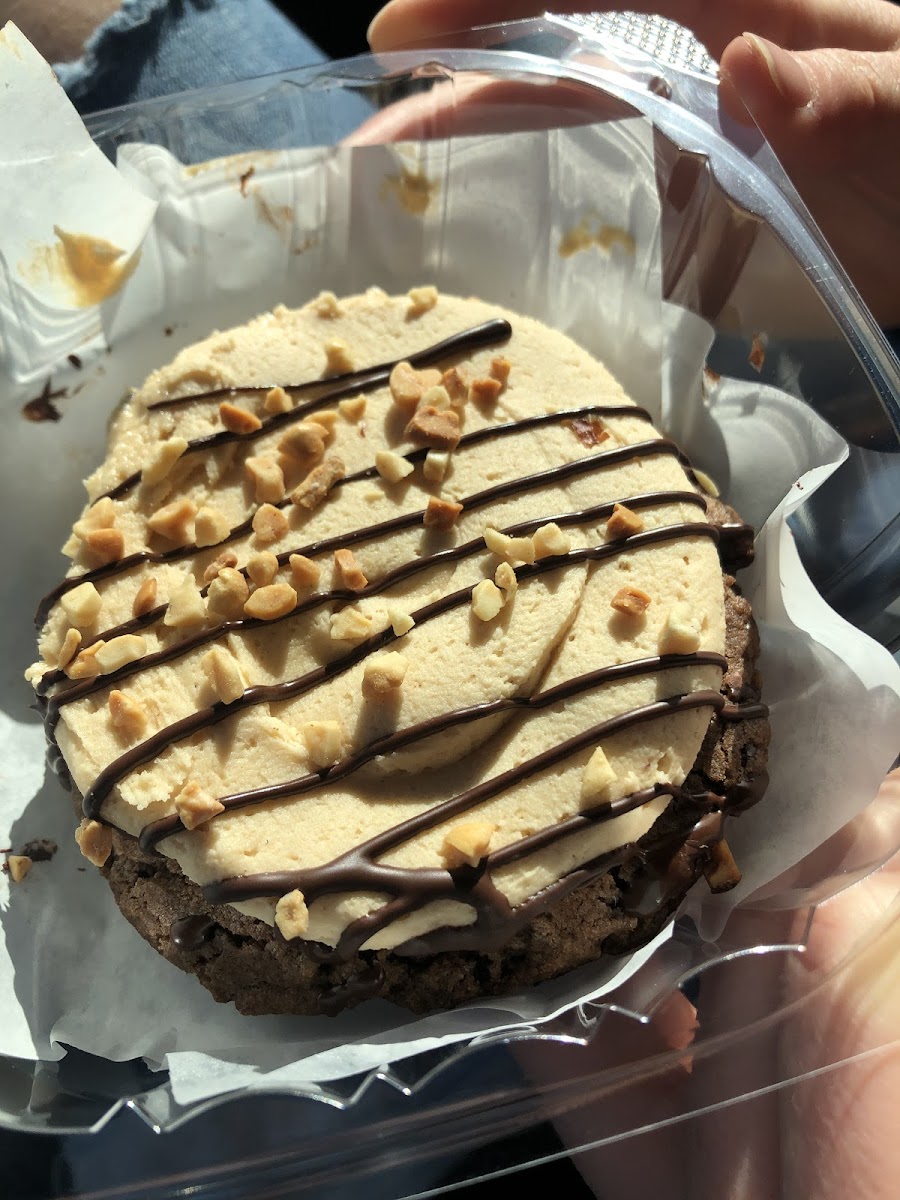 Gluten free chocolate cookie with peanut butter frosting.