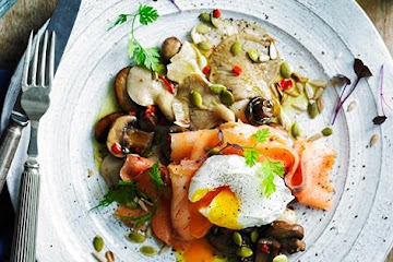 Mixed mushrooms with smoked salmon, egg and seed topping
