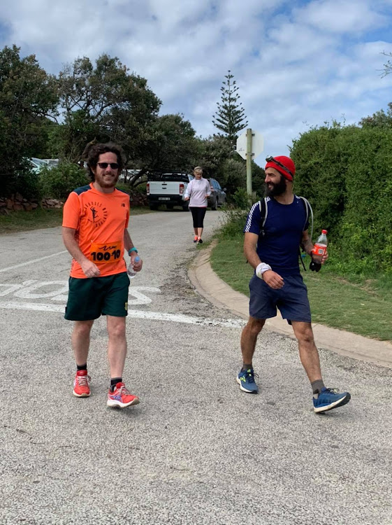 Tim Stones, who is deaf and partially sighted, with the support of a dedicated team of guides who assisted him through the night hours, completed his first 100 Miler. He is seen here with one of the guides, Mark Crandon.