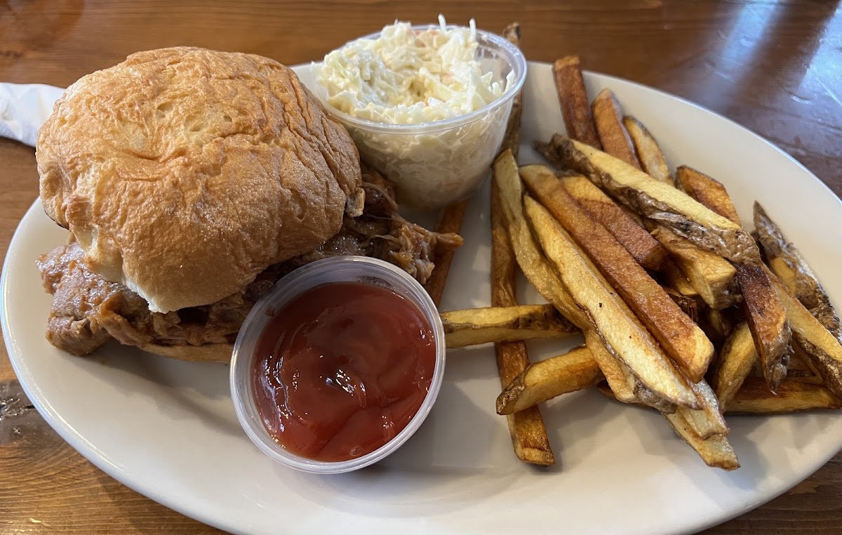 Pulled pork on a GF bun with a side of fries and cole slaw