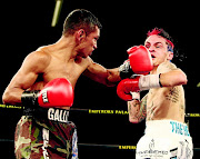 Defeated: Byron Rojas of Nicaragua, left, fights with SA's Hekkie Budler when Budler lost his crown. Picture credits: ANTONIO MUCHAVE