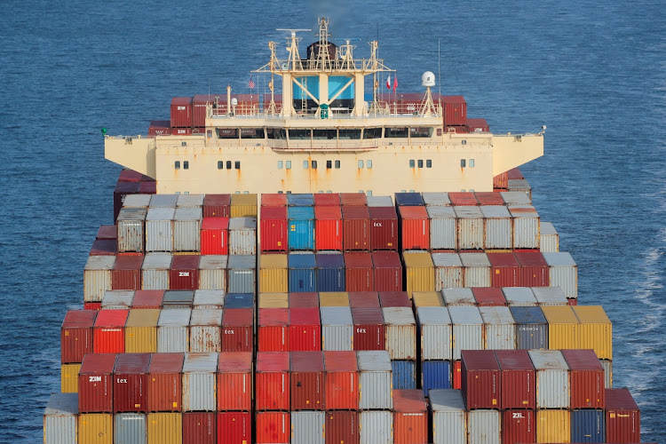 Containers are stacked on the deck of a cargo ship in New York Harbour, New York, the US. File photo: REUTERS /BRENDAN MCDERMID