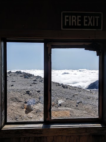 Syme Hut window view sea of clouds