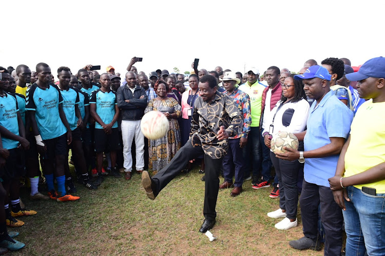 Siaya Governor James Orengo dribbling a football during the official opening of Migwena Community Sports and Cultural Festival 2022 on December 29.