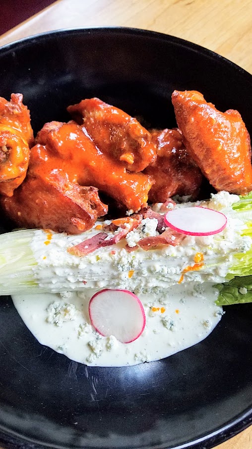 Bunk Bar at Water Ave, Buffalo Chicken Wings and Wedge, a generous serving of 6 wings with Franks Red Hot, and instead of boring celery sticks you get a whole wedge salad of romaine, blue cheese dressing & bacon