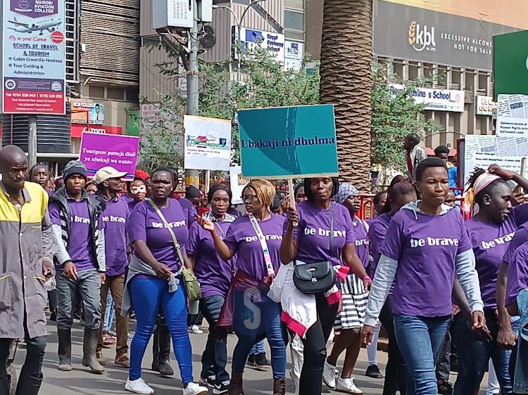 Members of the Brave Movement get ready to start a peaceful march in Nairobi to mark the World Day for Prevention, Healing and Justice to end Childhood Sexual Violence on November 18, 2022.