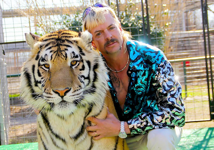 Joe Exotic with his tiger, from 'Tiger King'.