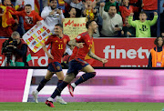 Spain's Joselu celebrates scoring their third goal with teammate Yeremy Pino in the Euro 2024 Group A qualifier against Norway at La Rosaleda Stadium in Malaga on March 25 2023.
