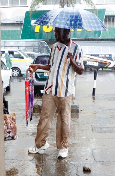 A resident sells umbrellas.