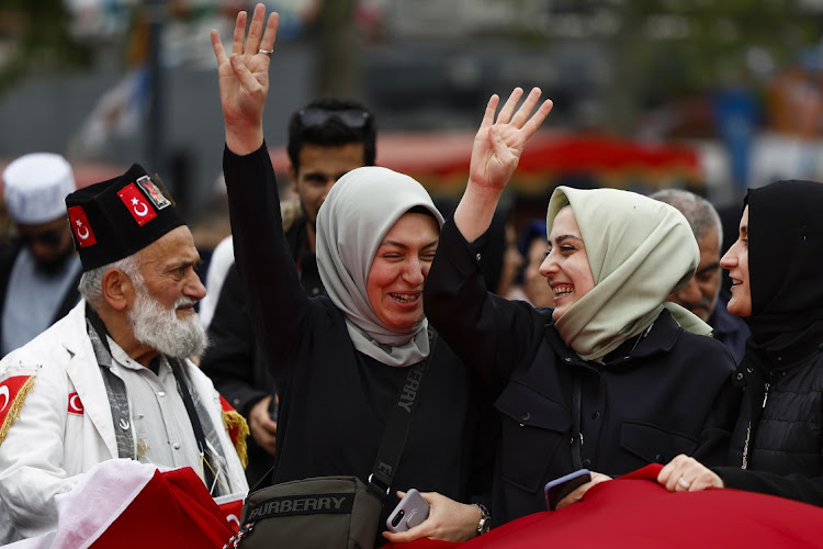 Supporters of Turkey's President Recep Tayyip Erdogan wave AK Party flags ahead of the weekend’s election in Istanbul, Turkey, May 11 2023. Picture: JEFF J MITCHELL/GETTY IMAGES