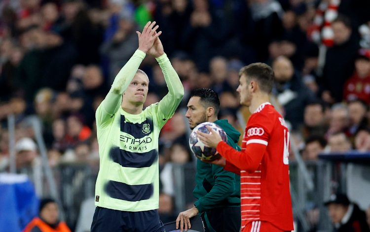 Manchester City's Erling Braut Haaland applauds the fans as he is substituted off in the Uefa Champions League quarterfinal second leg against Bayern Munich at Allianz Arena in Munich on April 19 2023.