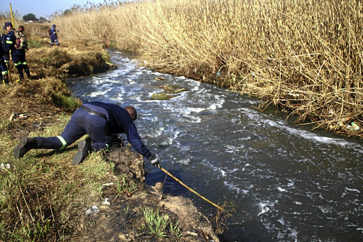 The search and rescue team had to block part of the river to get to Athini Bokveld’s body that was trapped in reeds.