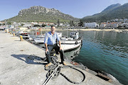 Michael Townsend at Kalk Bay harbour, where his Harbour House Group began.