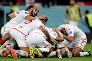 Wahbi Khazri of celebrates his goal with his Tunisia teammates in the World Cup group match against France at Education City Stadium in Al Rayyan Qatar on November 30, 2022.