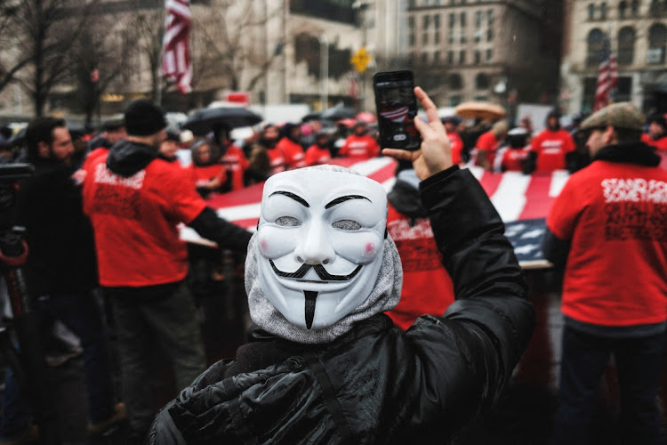 People gather outside the City Hall during an anti-vaccine mandate protest in the Manhattan borough of New York City, New York, US, February 7, 2022.