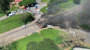 Angry residents burned debris and tyres at the intersection of Parkgate and Ottawa in protest against weeks of going without water. The SAHRC is meeting with city officials about the issues. File photo.