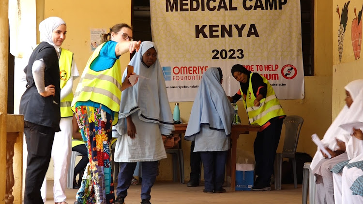 Medical personnel from Belgium under the Time for Help organisation with their Tukrkish counterparts, Omeriye Foundation, assist students to go for medical check-up at the Malindi Islamic Orphanage Centre during their one-week medical camp in Kilifi and Tana River.